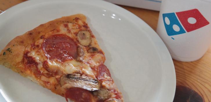 Domino's new "pizza theater" concept sets sales record.