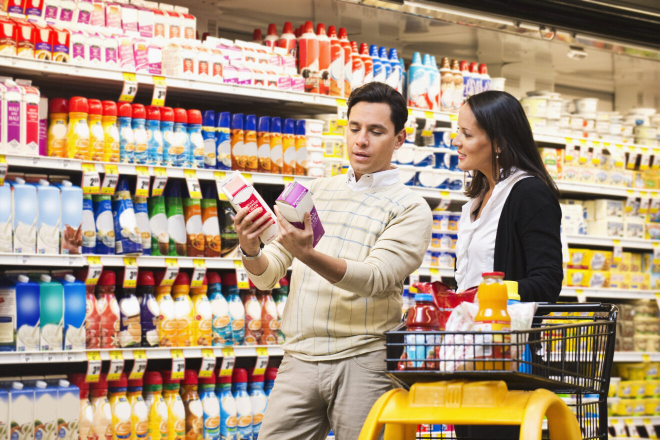How collaboration can help retailers, manufacturers solve the pricing puzzle [image: man and woman comparing products in grocery aisle]