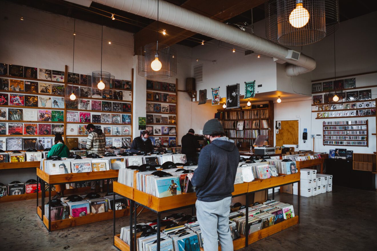 People shop at a record store.