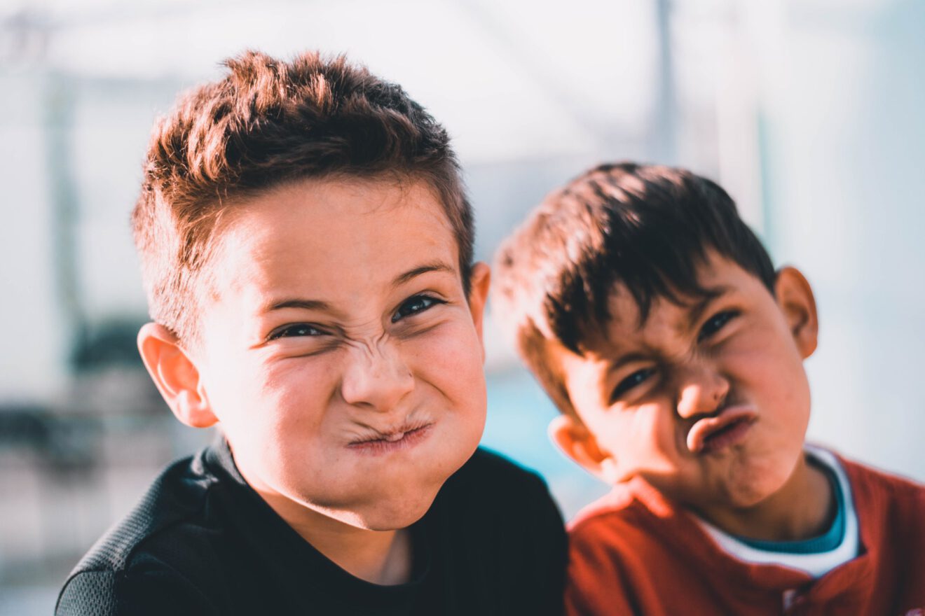 two boys making funny face Scaling student behavior and support through SEL