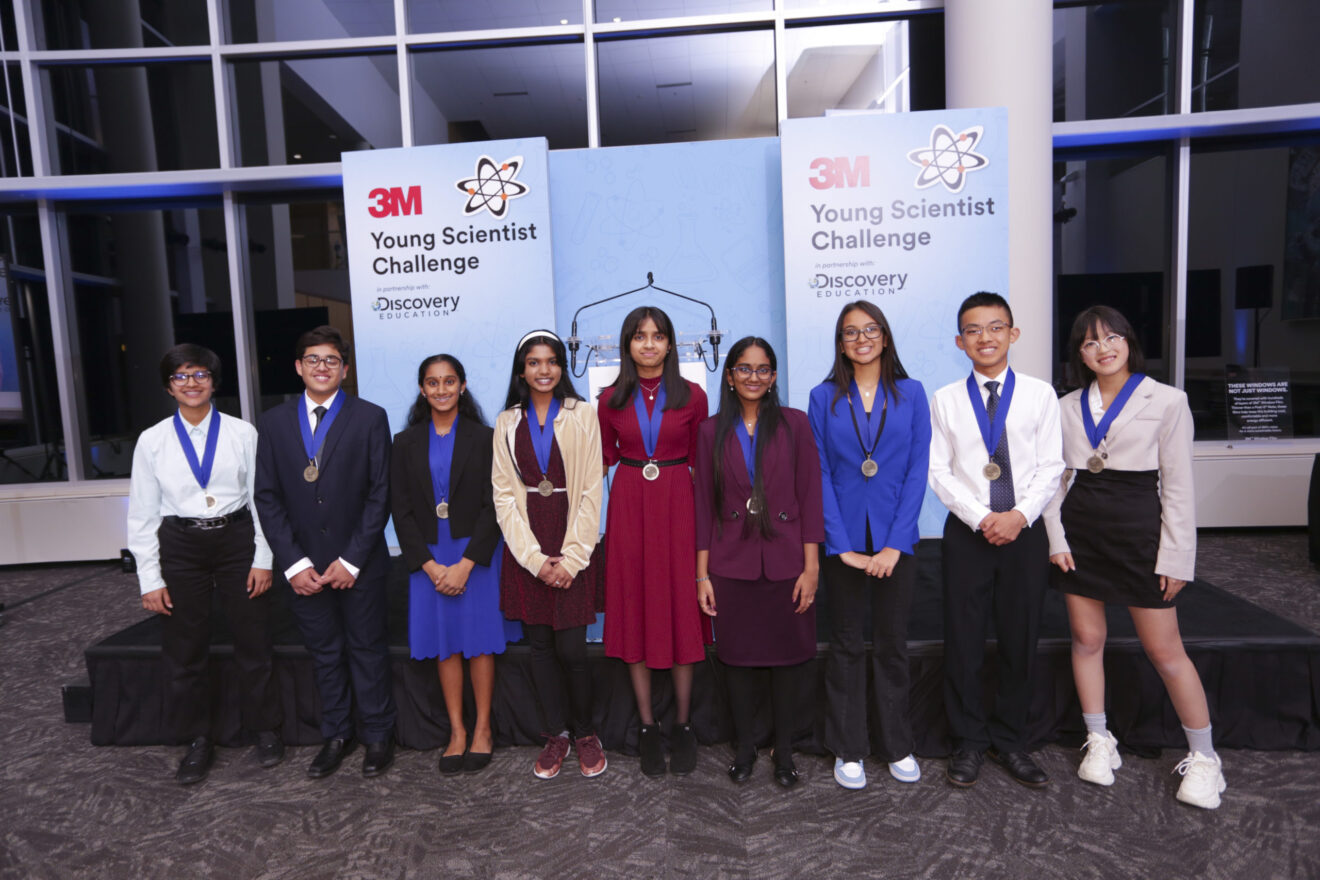 9 finalists for 3M Youg Scientist Challenge 2002 standing in a line with medals on