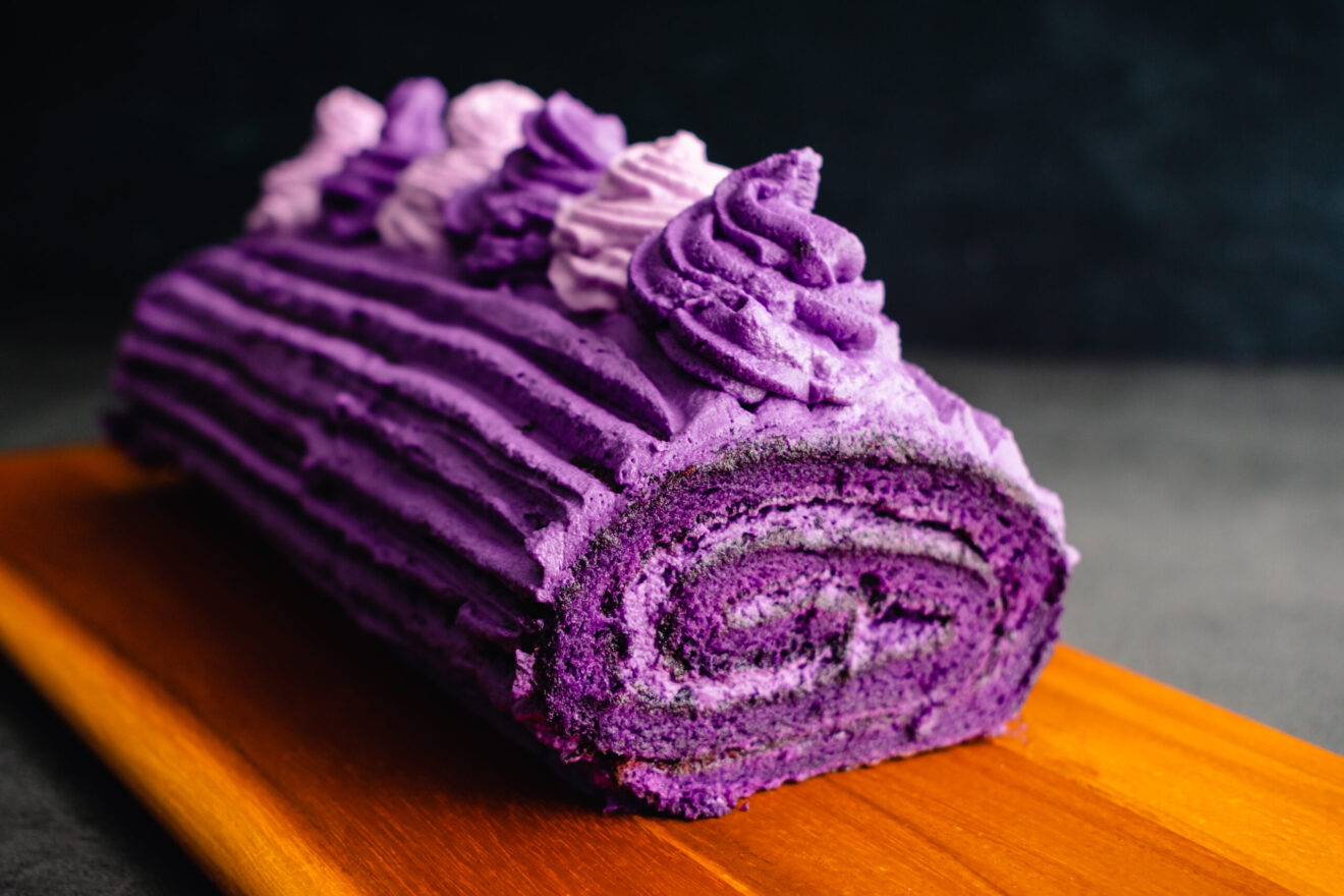 Roulade made with purple sweet potatoes and whipped cream icing
