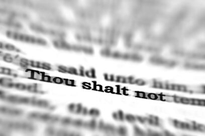 Detail closeup of New Testament Scripture quote Thou Shalt Not for article on instructional coaching