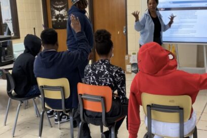 Jackson, Mississippi high schoolers brainstorm with teacher Myesha Wallace as they ideate on potential Solve for Tomorrow solutions for community issues. for article on inclusivity in learning