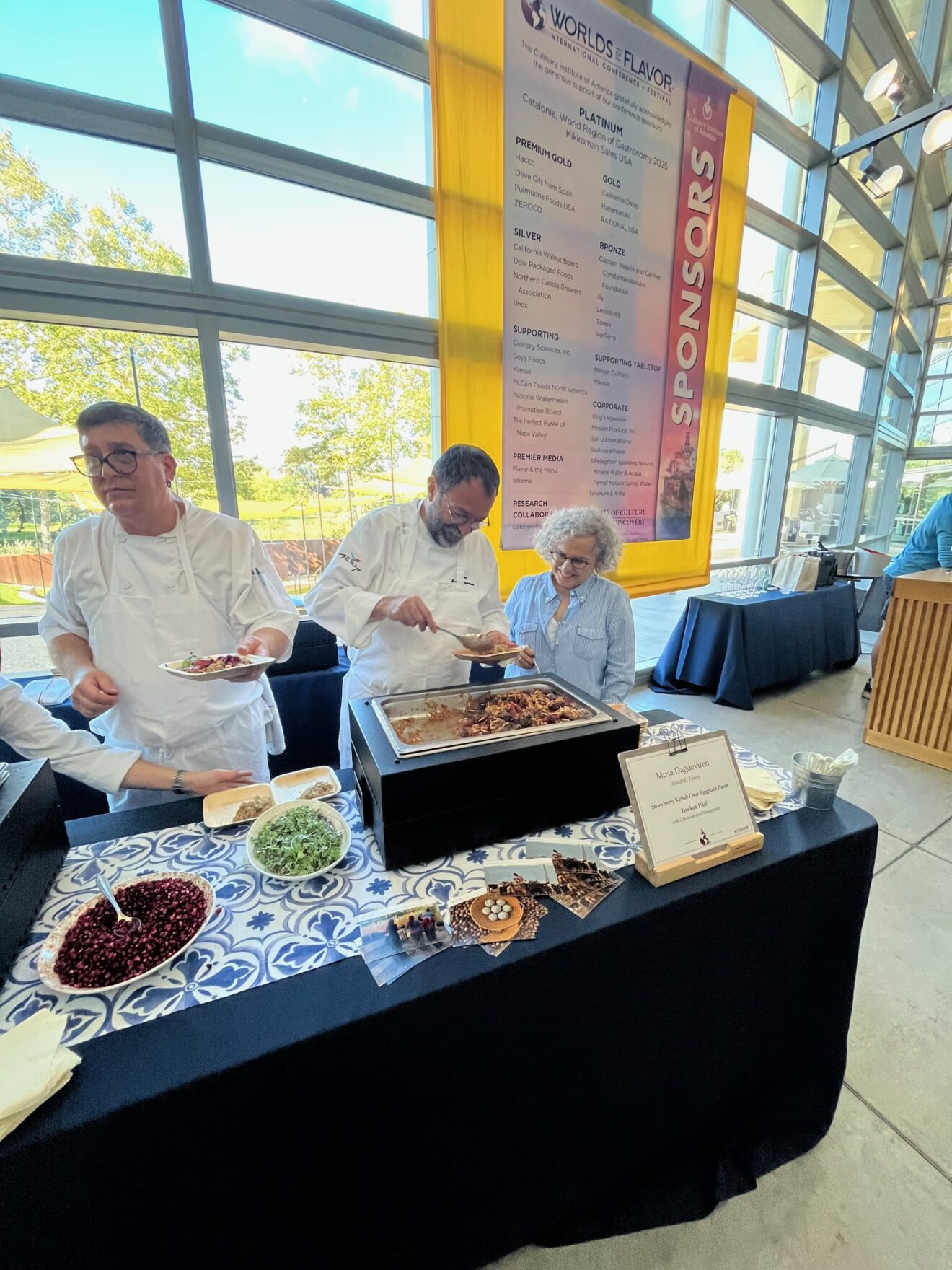 Chef Musa Dağdeviren serves strawberry kebob over eggplant puree alongside freekeh pilaf with chestnuts and pomegranate.