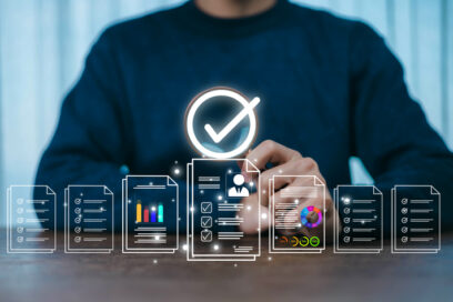 A person reviewing digital documents and data charts with a highlighted checkmark symbol represents workflow approval, data verification, business analysis, and efficient digital document management.