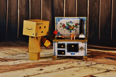 A figure made out of cardboard boxes prepares food