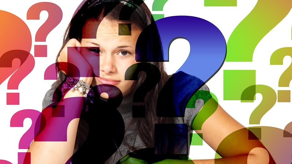 A woman surrounded by question marks
