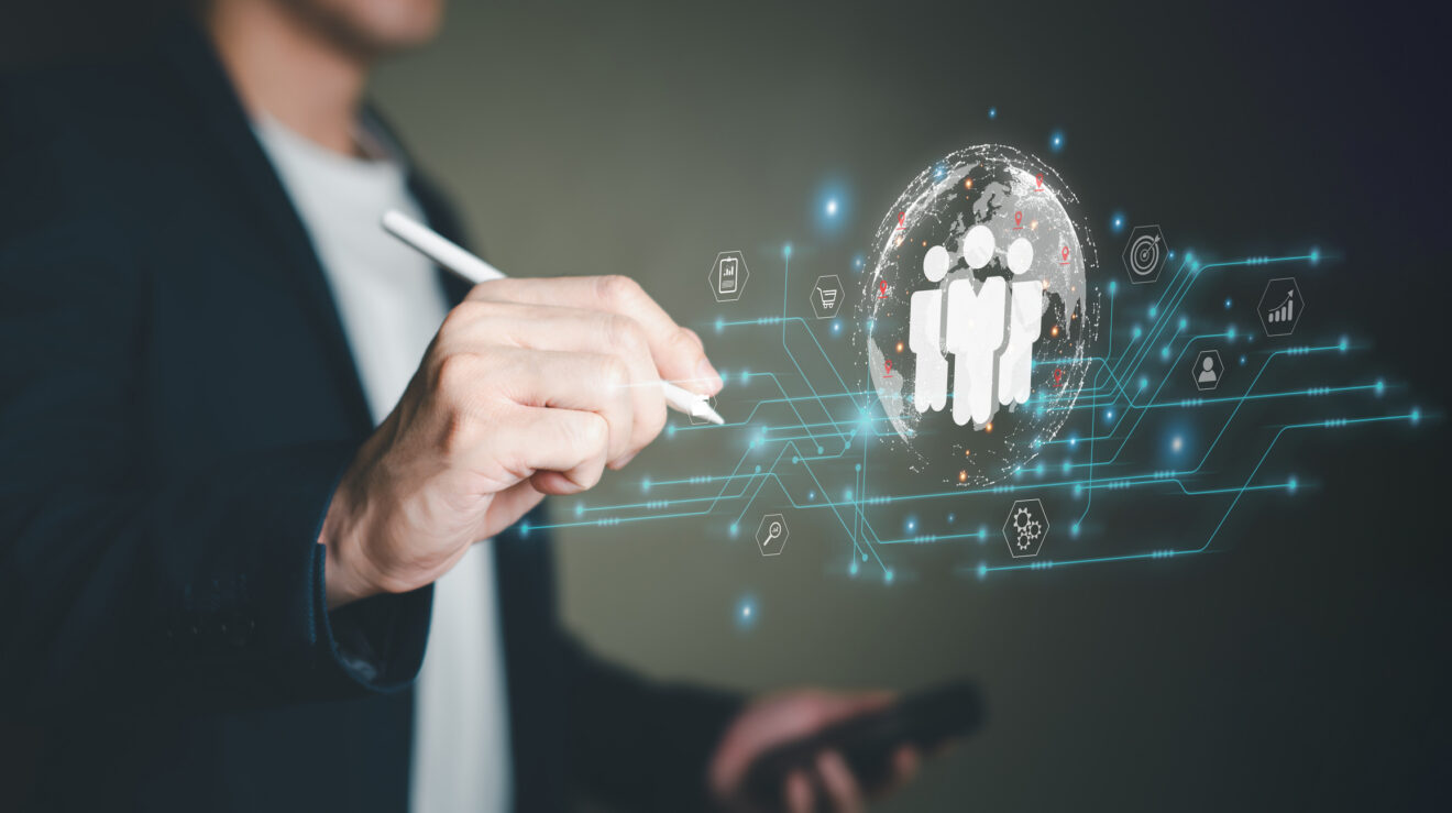 Businessman point at global online marketplace and reach for customer engagement with insight data analytic, business intelligence. SEO marketing big data strategy for worldwide omnichannel market.