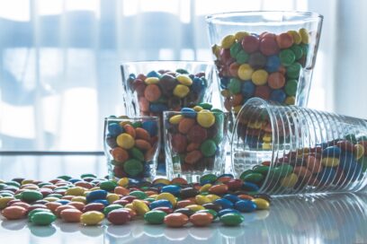 A photo of glasses filled with chocolate candies.