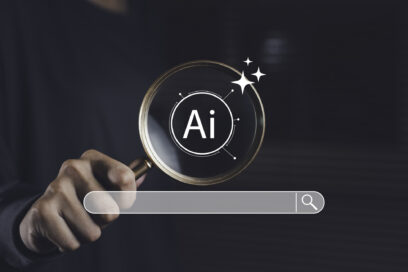 Magnifying glass focused on AI symbol with search bar, representing artificial intelligence technology used for smart search, digital exploration, and online data optimization. Used for SmartBrief Marketing Original on AI search engines, with headline: AI doesn’t care about your ad budget