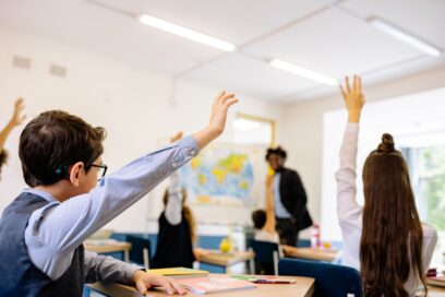 Kids in class listening to speaker