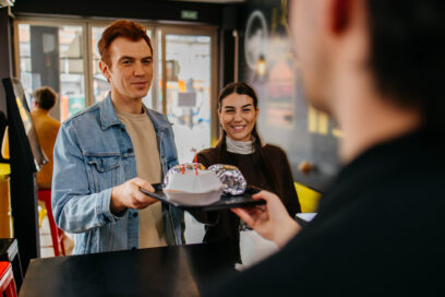 Couple picking up food at the counter in a fast food restaurant