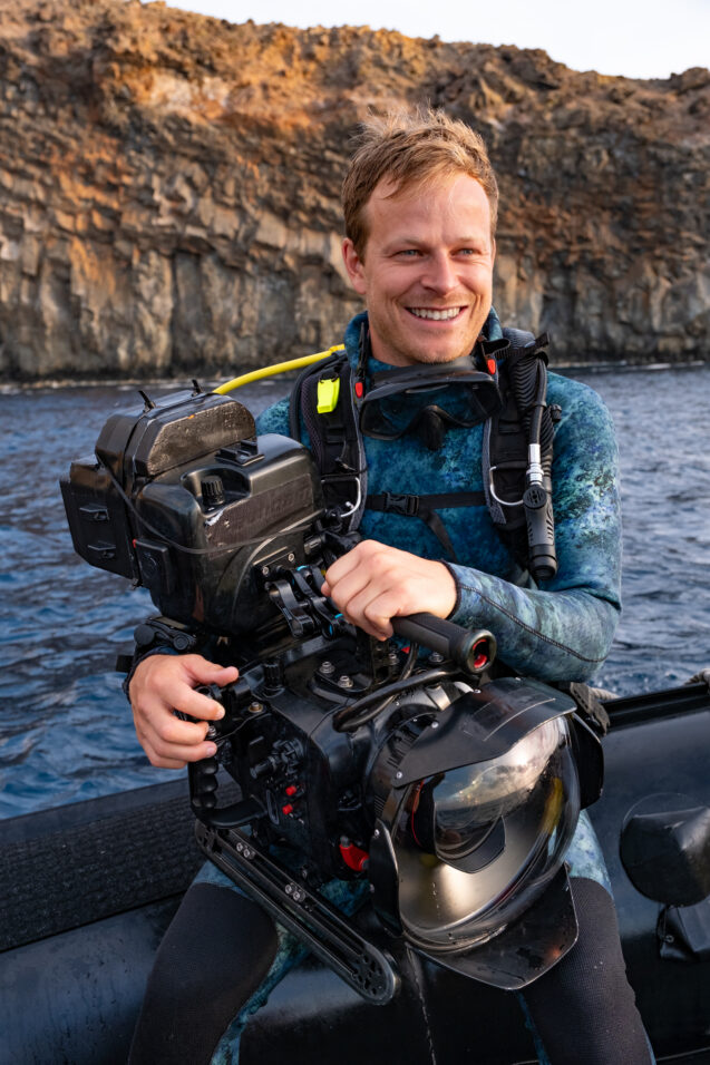 Host, Bertie Gregory, with his camera ready, excited at the prospect of another dive.