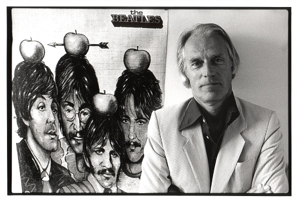 BELGIUM - JUNE 15: Photo of George MARTIN; posed, with poster of Beatles (Photo by Rob Verhorst/Redferns)